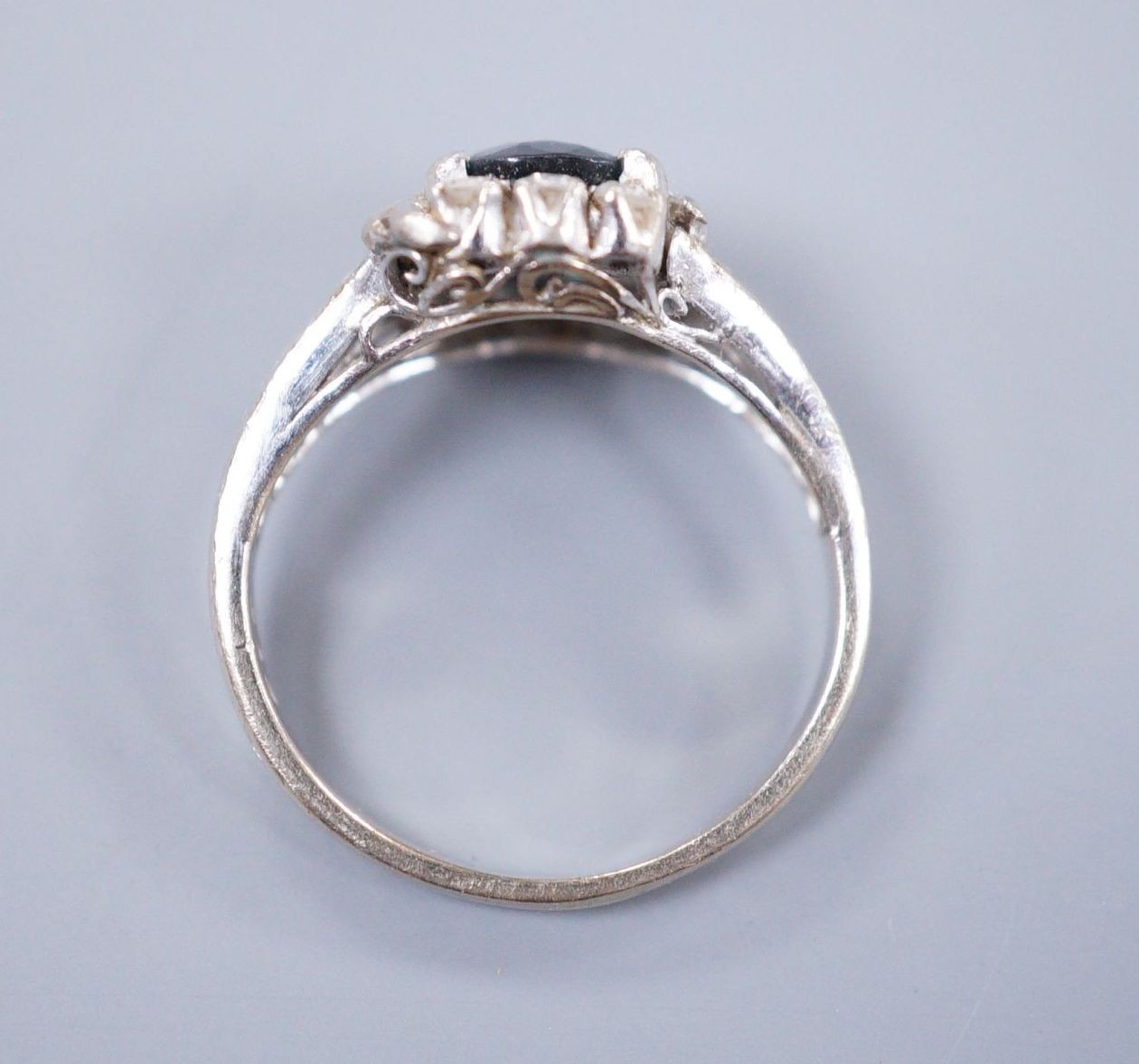 An 18ct white gold sapphire and diamond dress ring, size I